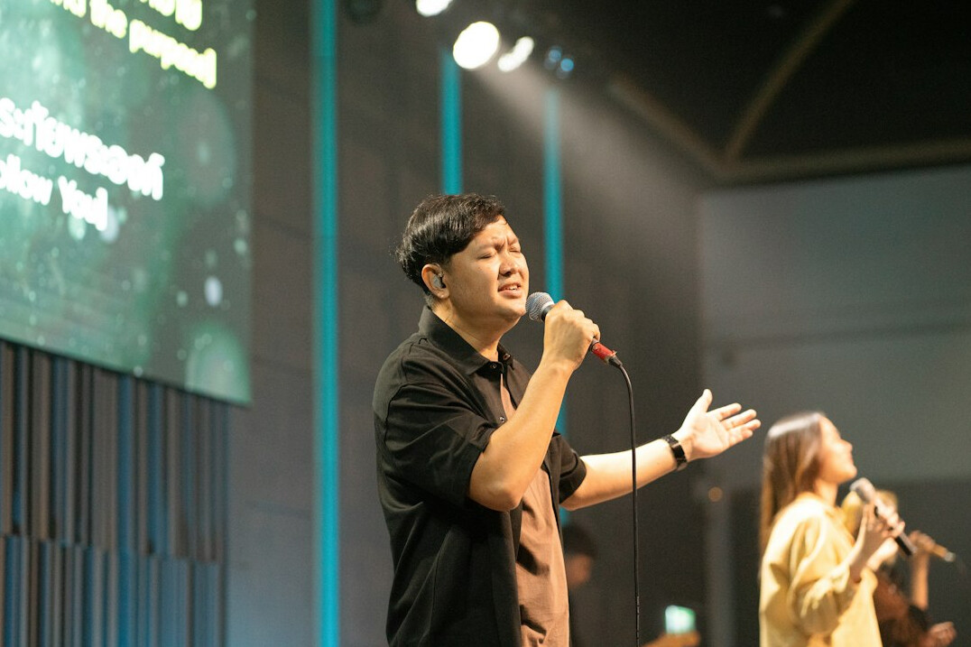 person speaking confidently on stage